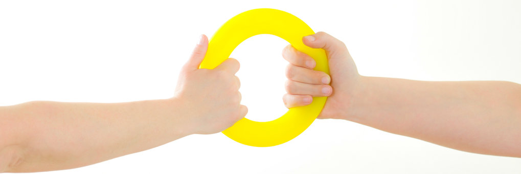 Two hands pulling a ring